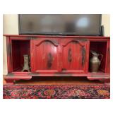 Vintage console stereo converted to an entertainment/TV stand - featuring a red and black distressed paint…..62-1/2 x 18-1/4 x 28-1/2 tall…..doors do not open…..OTHER CONTENTS NOT INCLUDED