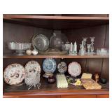 Contents of 2 shelves in upper portion of corner cabinet - Crystal, clear glass, decorative plates, candles and more…..chipping on some