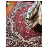 Large area rug in reds, blues, whites…..94 x 126…..OTHER CONTENTS NOT INCLUDED