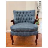 Upholstered tufted back arm chair with exposed wood arms and legs…..hues of blue with multi-color design pattern…..25-1/4 x 19-1/2 x 19 tall to seat (33 tall overall)