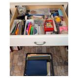 Grouping of office supplies - drawer and on floor - staplers, staples, pencils, post-it notes, push pins, hanging file folders and more