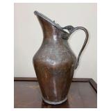 Antique Islamic Arabic lidded copper pitcher, often referred to as a ewer, featuring a hinged lid…..15” tall