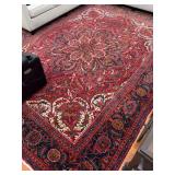 Vintage Persian Heriz rug, characterized by its bold geometric patterns and a prominent central medallion…..120 x 156