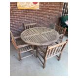 Gloster (Bristol, England) 5-piece teak wood patio set…..includes round table and seating for 4 - does show water spitting on legs from being on patio when trains but overall in good condition…..t