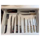 Kitchen drawer of various sizes knives from various makers