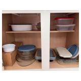 Contents of kitchen cabinet - PYREX casserole and bakeware pieces, plastic storage bowls and more