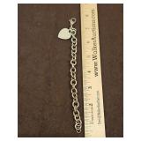 7" .925 charm bracelet w/.925 heart charm 35.2 total grams...