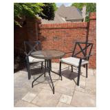 Lightweight black metal 3-piece patio set - includes round table with decorative braided design edge and 2 chairs - table measures 28”D x 28-1/2” tall - each chair measures 23 x 16 x 17-1/4 tall t