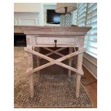 Wood accent table featuring a distressed white and gray finish, crossbuck supports and single drawer…..25 x 22-3/4 x 30 tall…..LAMP NOT INCLUDED