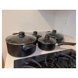 Set of (4) unmarked non-stick pots and pans - small & medium sauce pots and small & large stock pots