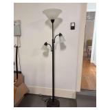 Matte black and bronze 2-arm floor lamp with larger light at top
