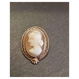 Gold tone cameo pendant. Unmarked. Non-reactive to magnet.