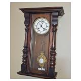 19th-century German regulator wall clock with 'mask' pendulum. 13x6.5 x 21.5 in tall. Trim piece missing from bottom right side but is available for reattachment. Was not keeping time when listed.