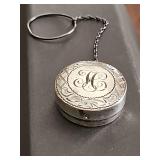 Antique sterling silver rouge or powder container with chain. Monogrammed 'H' 1 in diameter. 13.37 grams