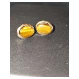 Women's gold tone tiger eye post earrings. Unmarked. Non-reactive to magnet.