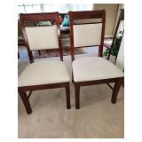 Two Ashley Furniture sturdy chairs. Upholstery is not damaged. It's the pattern style. 21x19x38 in tall. Seat height is 19 in