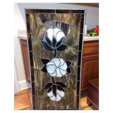 Stained glass panel depicting Cotton Boll design…..23-3/4 x 47-3/4…..2 cracks on either side in the middle possibly caused from slight bow/bend