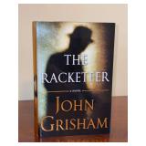 Signed first edition John Grisham novel titled “The Racketeer”