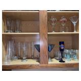 Contents of game room bar cabinet - stemware, glassware, beer glasses and more - TOP SHELF IS NOT INCLUDED