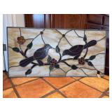 Stained glass panel depicting birds perched on branches design…..47-3/4 x 24…..lower right hand corner is damaged