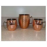 (3) copper-plated stainless Moscow Mule Mugs - 1 is hammered copper-plated stainless - 2 smaller are 4” tall and are by EcoOne (Silver One Intl) - larger hammered is 5-1/2” tall