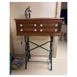 Antique Clark's ONT spool cabinet mounted on cast base with wheels…..29-3/4 x 21 x 40 tall…..lamp on top not included
