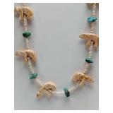 Native American style fetish necklace, likely Navajo or Zuni in origin, featuring carved bear figures and turquoise beads.