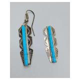Vintage sterling silver dangle earrings feature a needlepoint turquoise inlay design, in Navajo or Zuni styles. One earring in missing the wire. Weigh 2 grams.