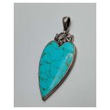 Heart-shaped Kingman turquoise pendant set in 925 sterling silver, a style characteristic of Southwestern and Native American artisan jewelry. Weighs 8 grams.