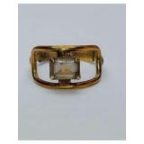 Antique Winard Jewelry Co. emerald-cut stone within a rectangular frame. V2012KGF WINARD II stamped inside. Size 6. Weighs 0 grams.