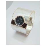 Vintage Marcel Boucher hinged cuff wristwatch from the 1960s-1970s, featuring a clear lucite and silver-toned band with a 17-jewel manual movement. Works. For a petite wrist.