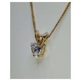 Classic solitaire heart pendant necklace, a single clear stone in a prong setting on a delicate chain. 9" long.