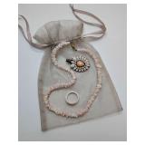 Vintage light pink puka shell necklace, hand-carved shell ring, size 8, decorative hair  clip, featuring layered floral-inspired petals and beaded detailing, and gift bag
