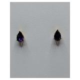 Pear-shaped, purple gemstone stud earrings set in gold. Super sparkly.