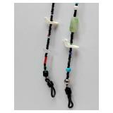 Native American handmade eyeglass chain with various beads and small dove-shaped charms.