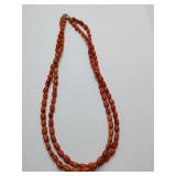 Vintage Italian Mediterranean coral bead necklace, likely from the 1970s, featuring oval beads and a 925 silver clasp.