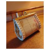Vintage-style rectangular coin purse, a hinged metal clasp frame and a textured, bamboo body. 3" x 3 1/4".