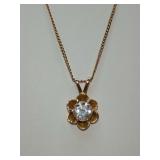 Clear solitaire stone in Buttercup setting, chain clasp has AJC 14K CO on it. 9 1/2" long.