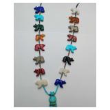Rare Navajo or Zuni fetish necklace, featuring numerous small, carved gemstone animals (often called fetishes) and a larger central turquoise bear figure.