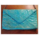 Turquoise, crinkled envelope-style evening clutch bag with a silver chain strap, by Jessica McClintock. 11 1/4" x 7", strap 11".