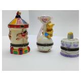 Porcelain Hinged Trinket Boxes, Carousel, Winnie the Pooh rattle, Birthday Cake. The Carousel and Cake are empty.