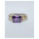 Vintage sterling silver ring features a large, faceted cushion-cut amethyst gemstone set in 925 silver. NV 925 stamped inside. Size 8. Weighs 4 grams.