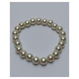 White faux pearl stretch bracelet.
