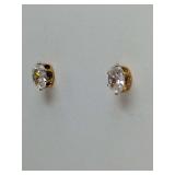 Avon oval-cut clear gemstone stud earrings in a yellow gold tone setting. Never worn