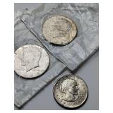 1979 United States Susan B. Anthony dollar coin 6 grams, 1965 Kennedy half dollar coin, 11 grams in bag, 1968-D Kennedy half dollar 11 grams in bag.