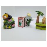 Porcelain hinged trinket boxes, toucan, Babar, palm tree & hut.
