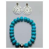 Stretchy faceted turquoise beaded bracelet with silver accent bead and a pair of Trollbeads post dangle Daylight Earrings.