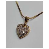 Heart pendant necklace with 18 clear stones, 18K stamped on pendant, chain made in Italy has 585 stamped on it, which is 14K. 8" long. Weighs 2 grams.   Kirei Jewels is an Italian brand that emphasize