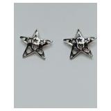 Silver-tone star stud earrings feature a distinctive "cut-out" design within the center of each five-pointed star. Need backs.