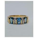 Gold ring set with blue gemstones and small diamond accents, costume. Size 7. Cannot make out maker.